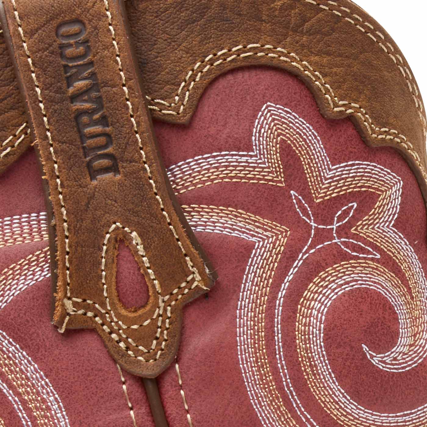 Close-up of a brown leather boot with Durango branding and intricate white stitching on a red shaft.