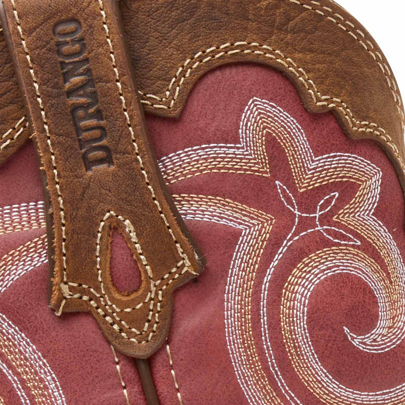 Close-up of a brown leather boot with Durango branding and intricate white stitching on a red shaft.