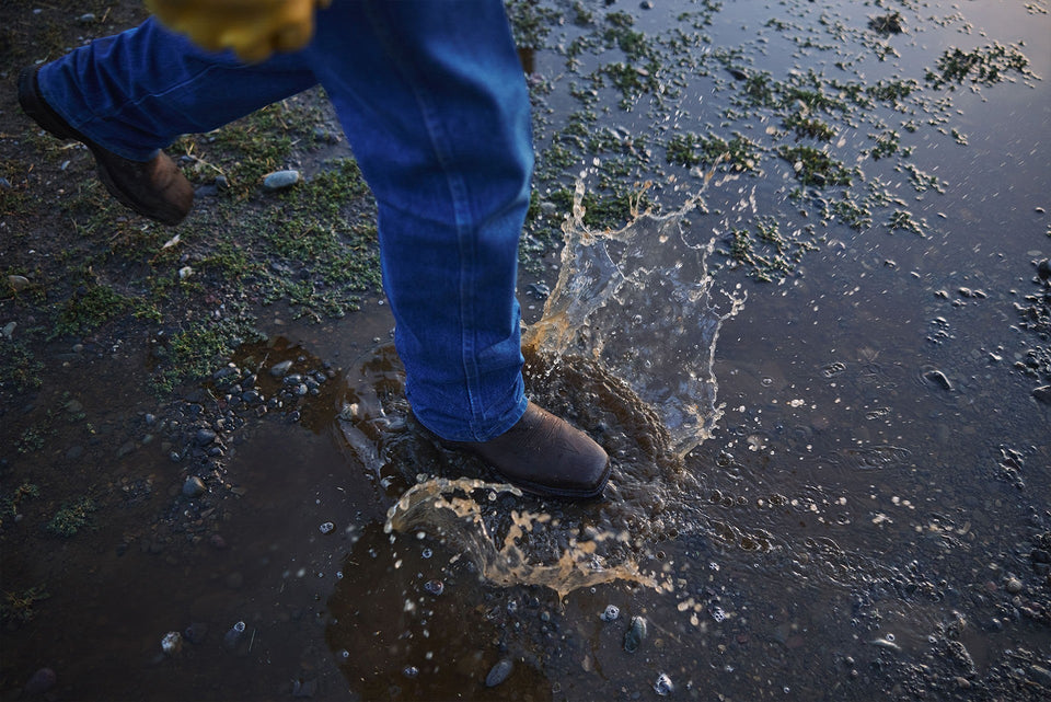 Waterproof Durango western boots stepping into water