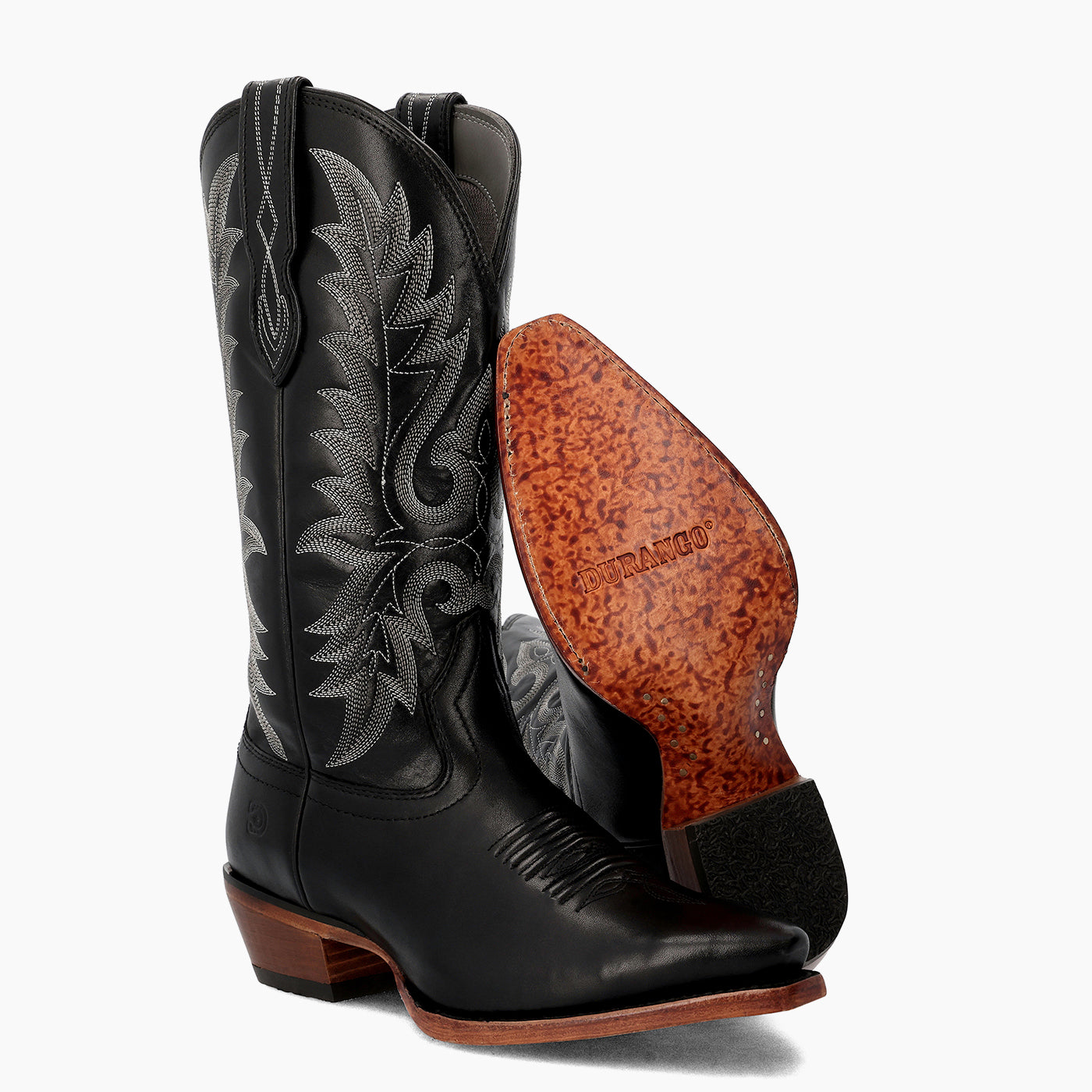 Front view of a pair of Durango black cowgirl boots with leather outsole showing