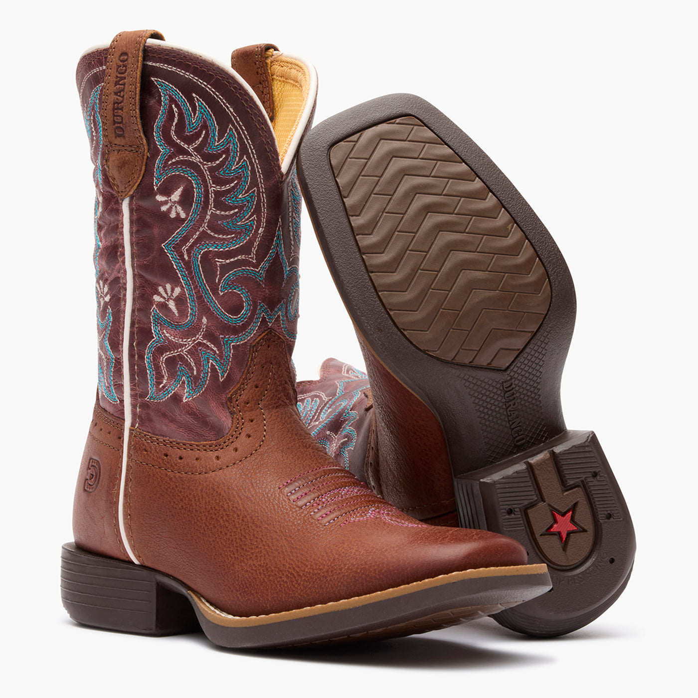 Outsole pair view of Durango kids' dark pink and brown cowgirl boots