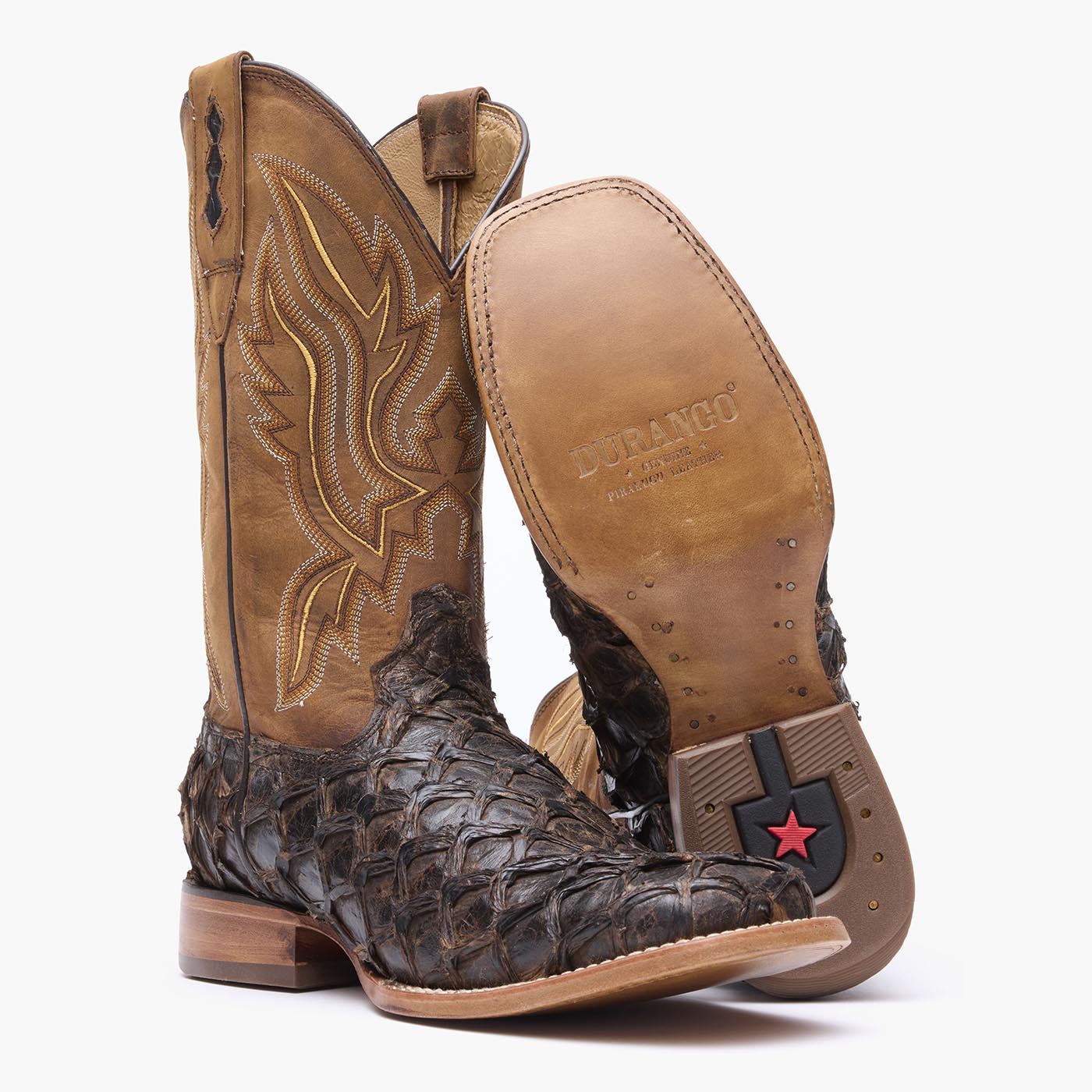 Leather outsole view of Durango brown square toe Pirarucu fish western boots