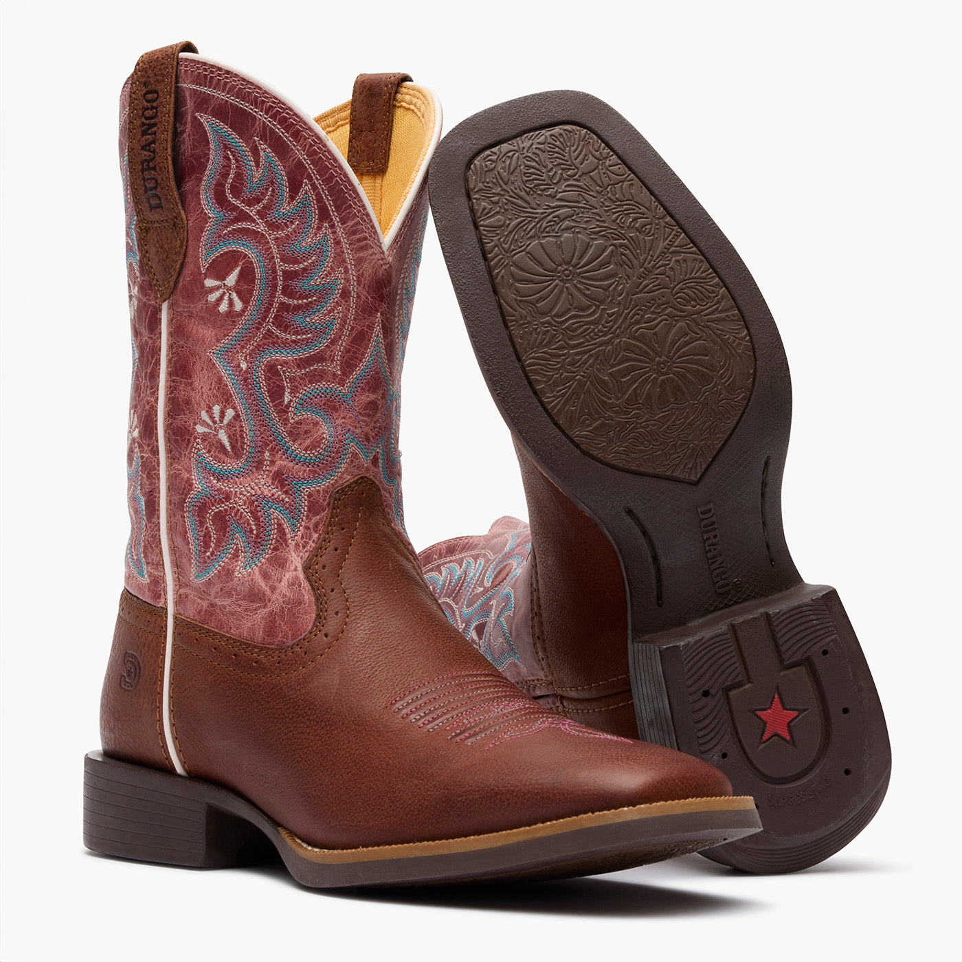 Outsole pair view of Durango women's dark pink and brown cowgirl boots