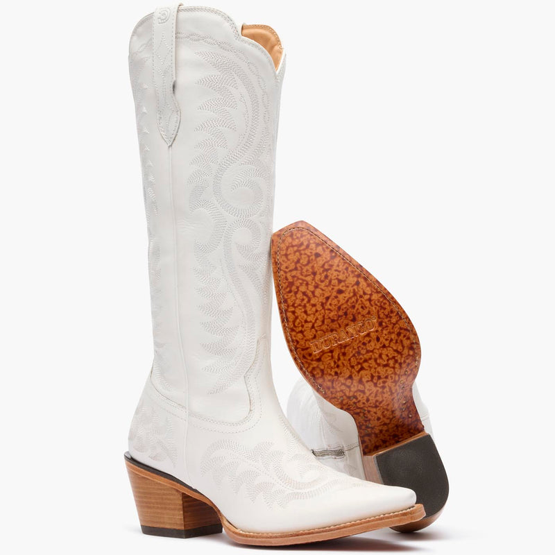 Front pair view of Durango white cowgirl boots with white stitching and leather outsole.