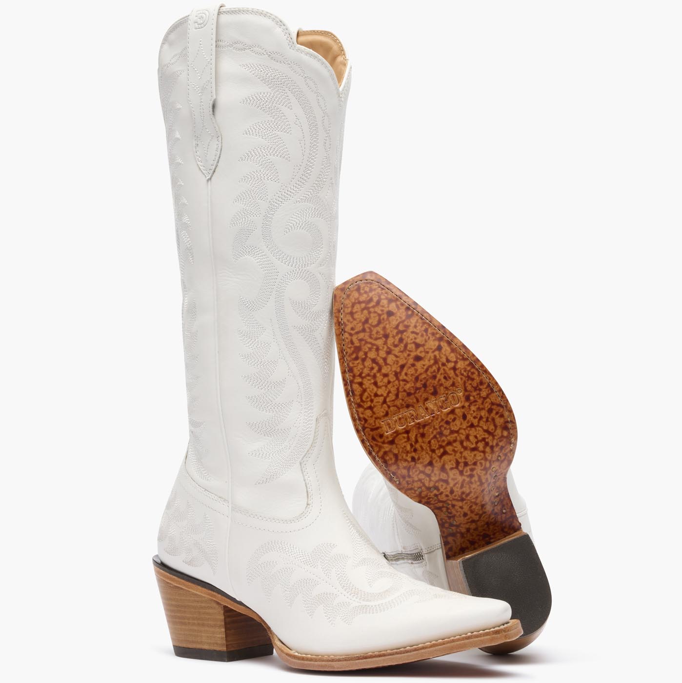 Front pair view of Durango white cowgirl boots with white stitching and leather outsole.
