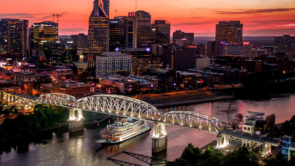 General Jackson Showboat sailing past Nashville at dusk