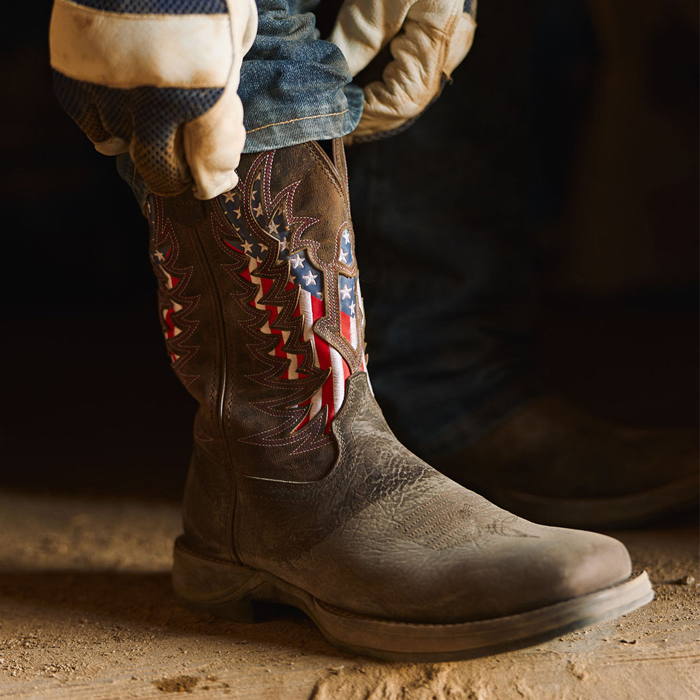 Brown Durango Rebel Ultra Lite western boot with American flag eagle design in a workshop