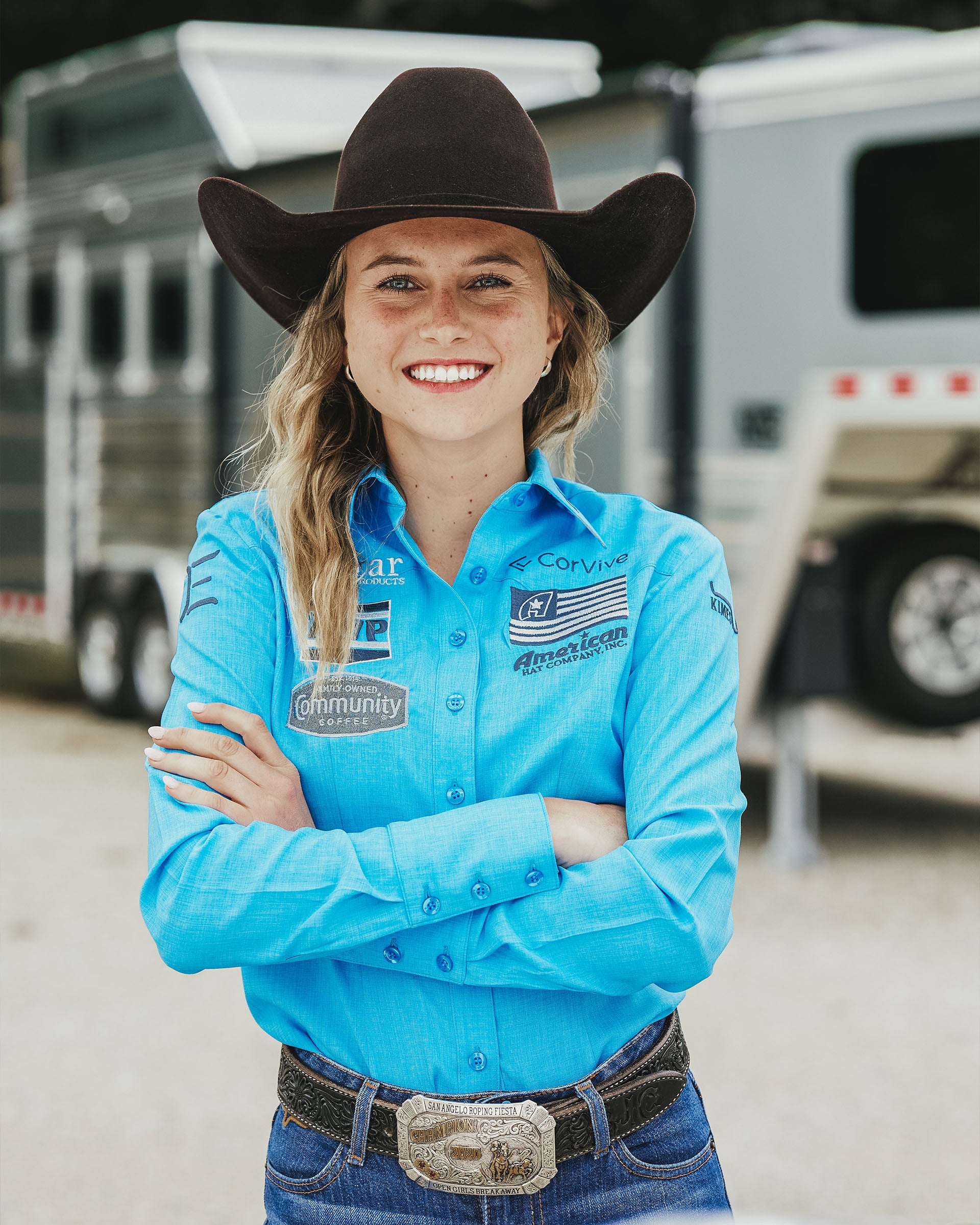 Team Durango Breakaway Roper, Josie conner in front of her horse trailer.