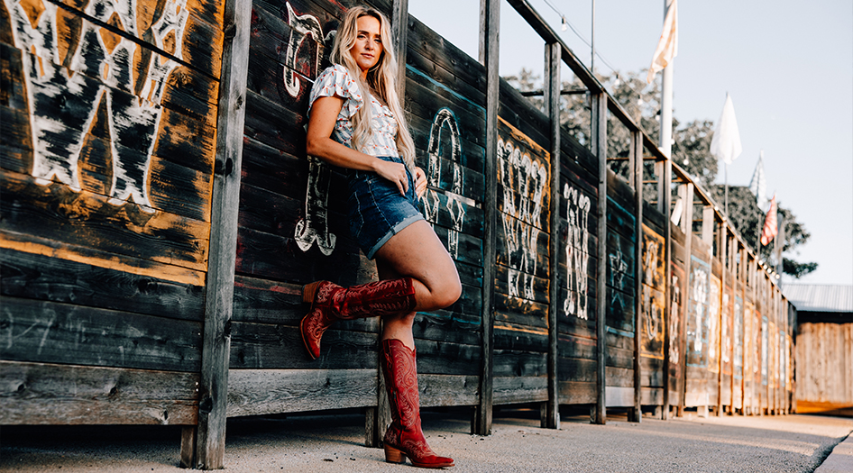 Women at Fort Worth Stockyards wearing Durango 16” tall western fashion boots, style DRD0472